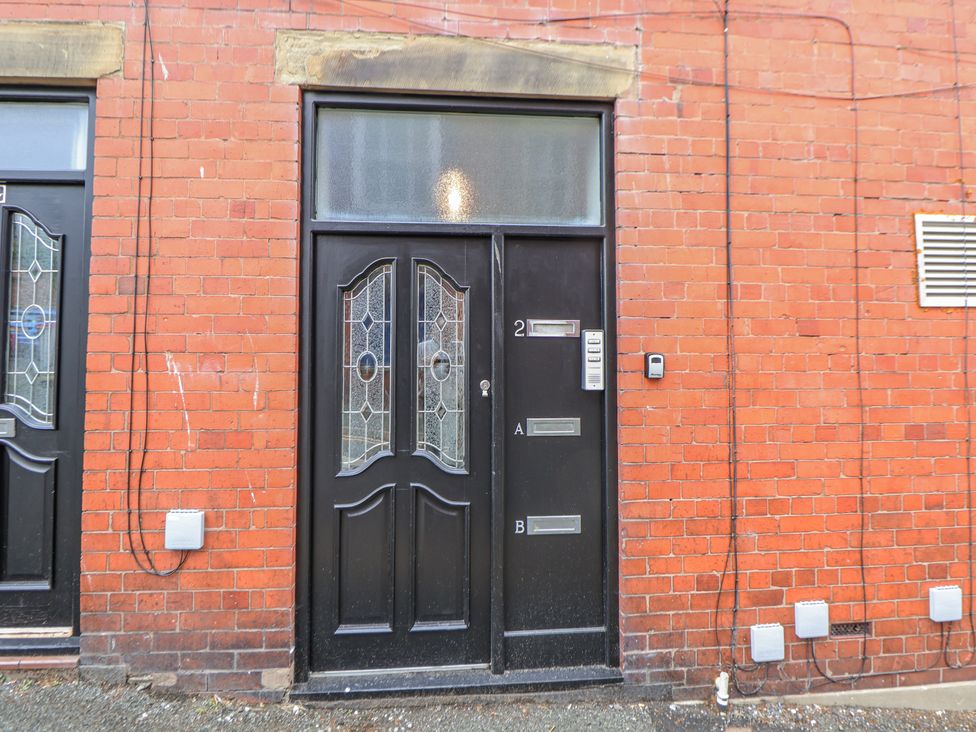 A front entrance with a door and intercom at No 2 Emporium Apartments Prestatyn