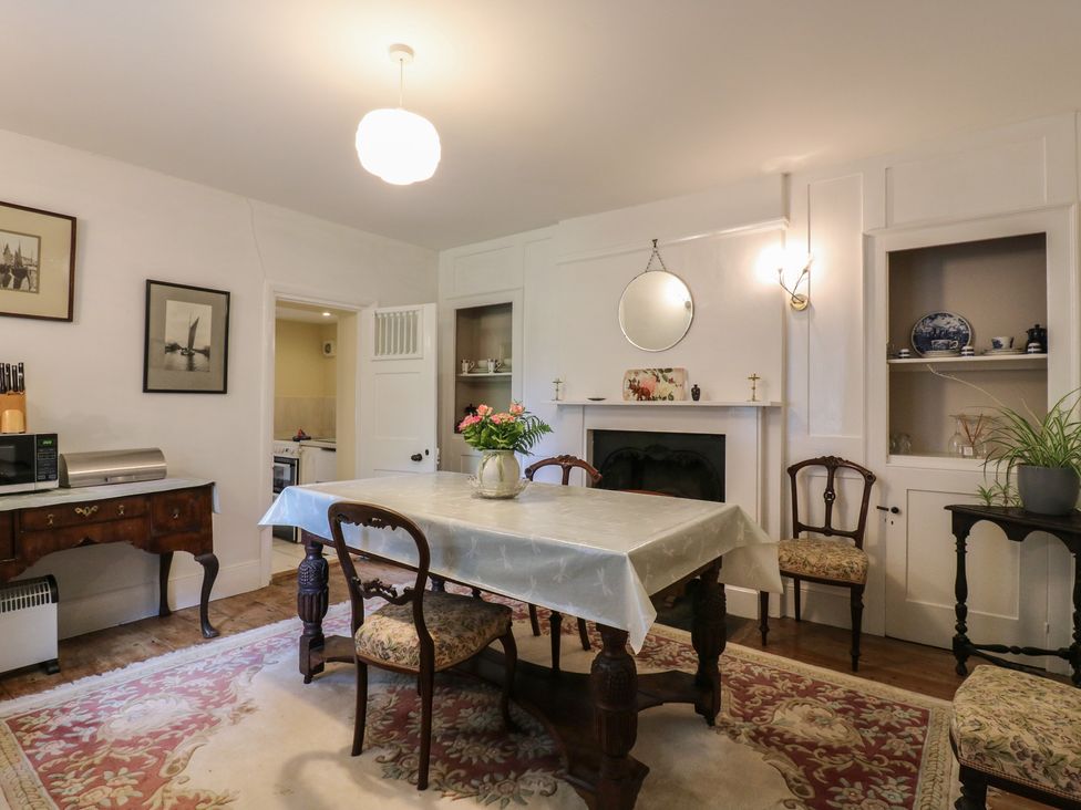 A dining room with a table and chairs at Curry Farm