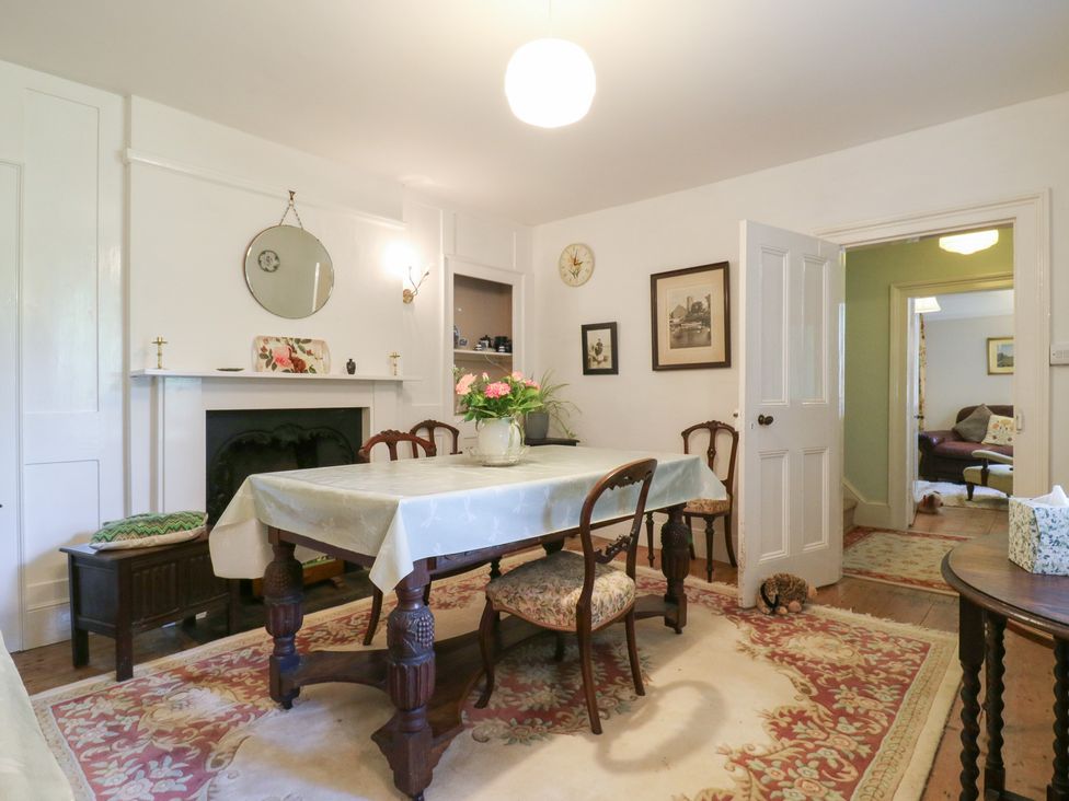 A dining room with a table and chairs at Curry Farm