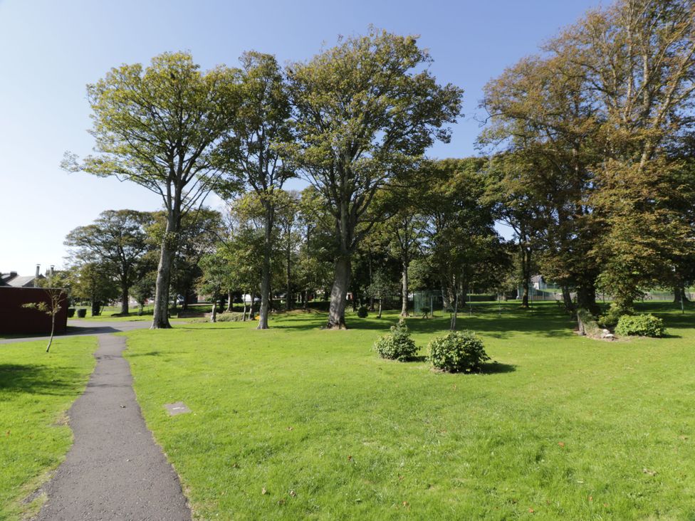 A park with trees and a pathway at 6 George Street, Isle of Cumbrae