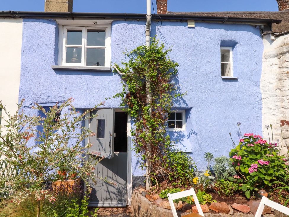 A house exterior with a door and windows at Carpenters Cottage in Okehampton