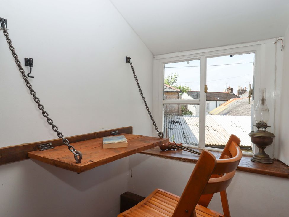 A study with a table and chair at Carpenters Cottage in Okehampton