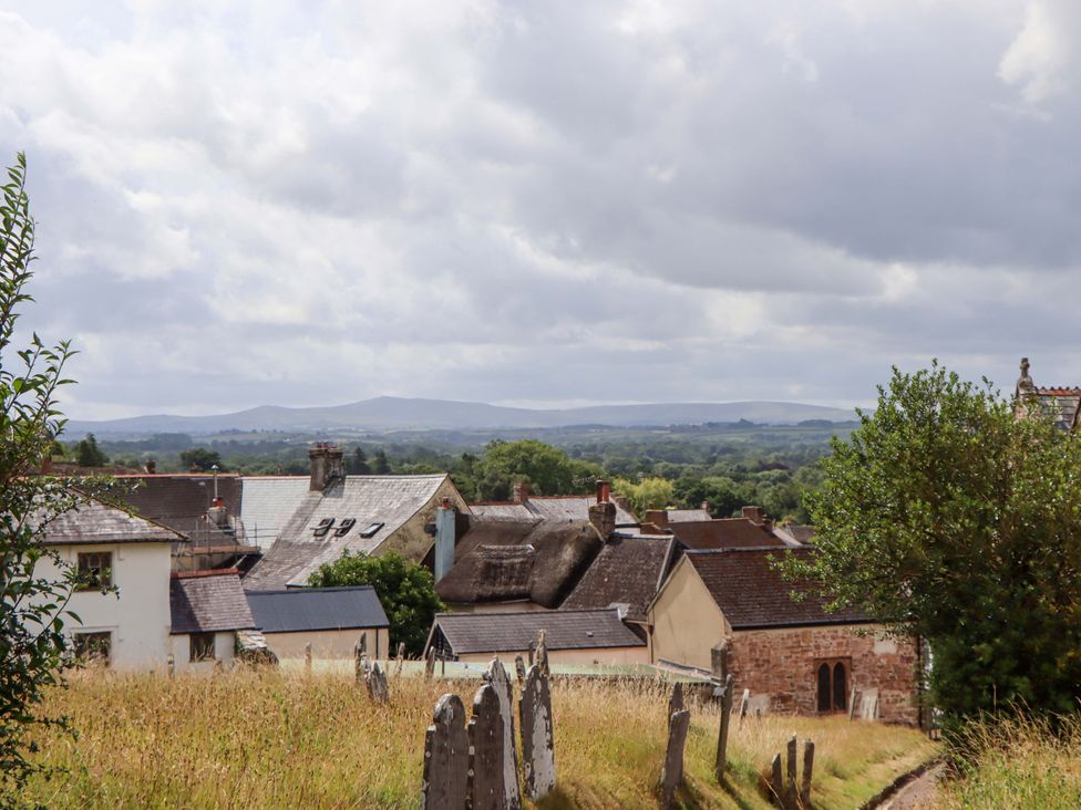 View of houses and hills under cloudy sky at Carpenters Cottage Okehampton