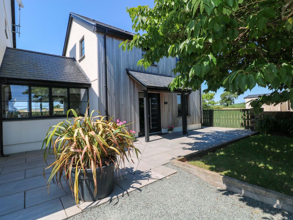 An outdoor area with a plant and patio at Just A Cottage St Florence