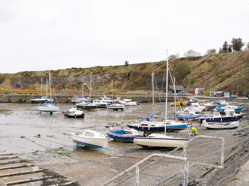 Boats at a harbor with low water at 9A Market Square