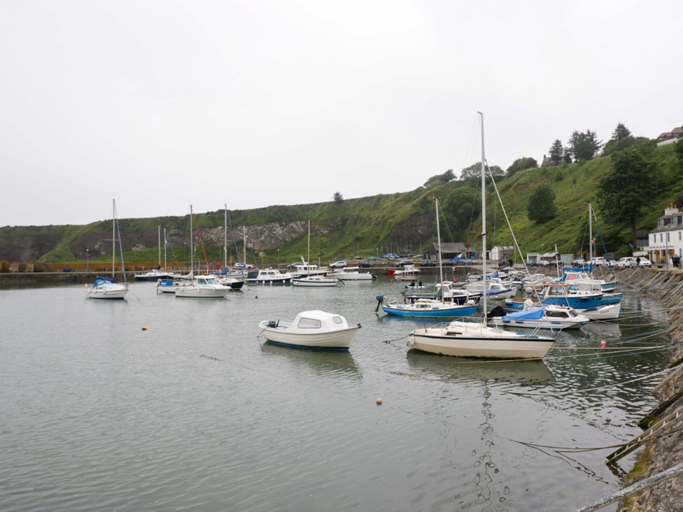 A harbor with several boats moored at 9A Market Square