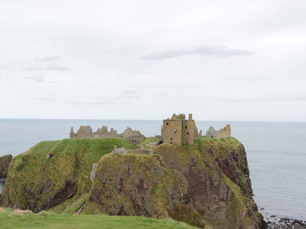 Castle ruins on a cliff overlooking the sea at Dunottar Castle in Scotland