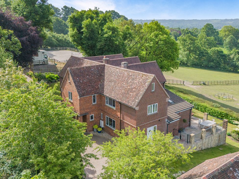A house surrounded by trees and garden at Underhill House
