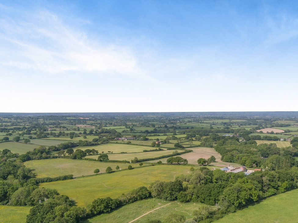 A landscape view with fields and trees at Underhill House