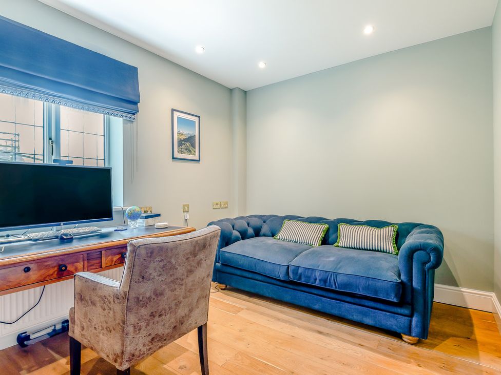 An office with a desk, chair, and sofa at Underhill House