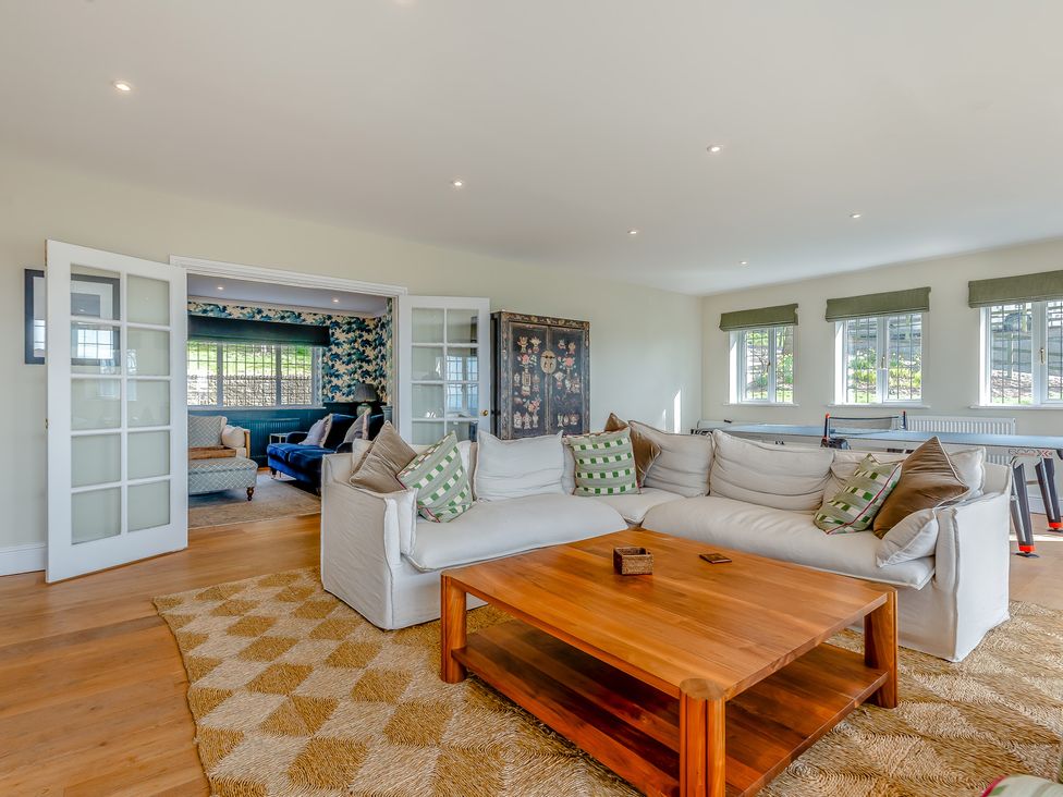 A living room with a sofa and coffee table at Underhill House 