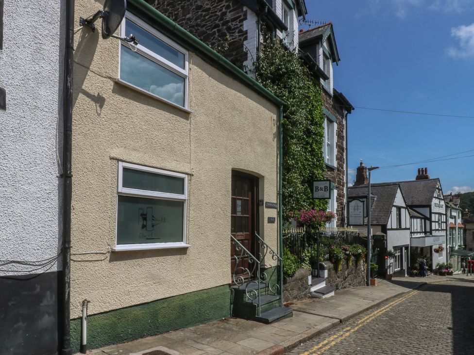 A house exterior with a sign and plants at 3 York Place, Conwy