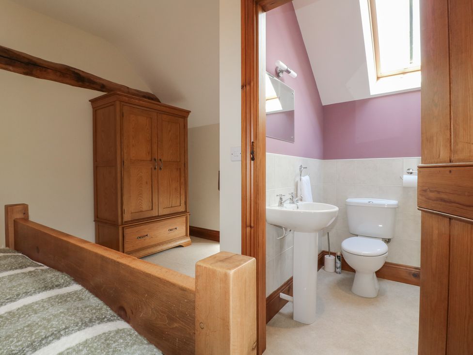 A bathroom with a sink and toilet at Carr House Farm in Waberthwaite