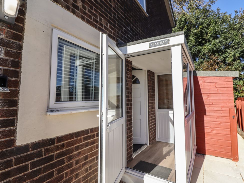 An entrance with a front door and window at 3 Longstone Park Beadnell