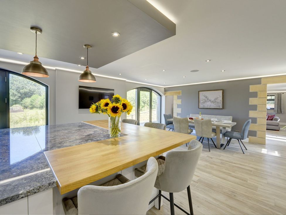 A kitchen with a dining area at The Gate House in Aldbrough St. John near Barton