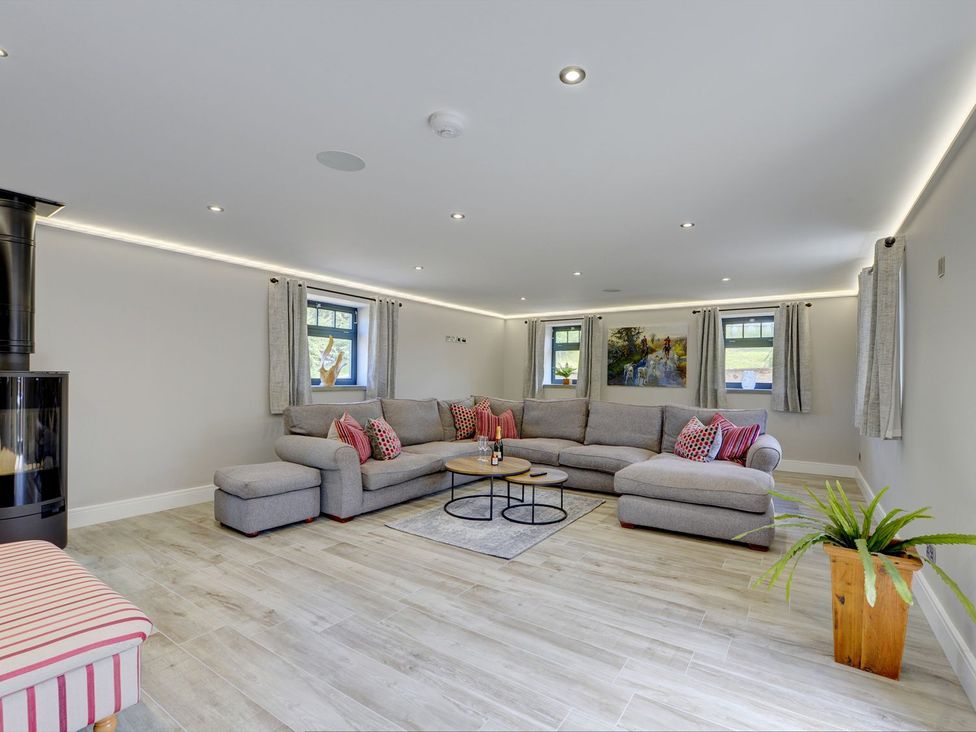 A living room with a sofa and coffee table at The Gate House near Aldbrough St. John