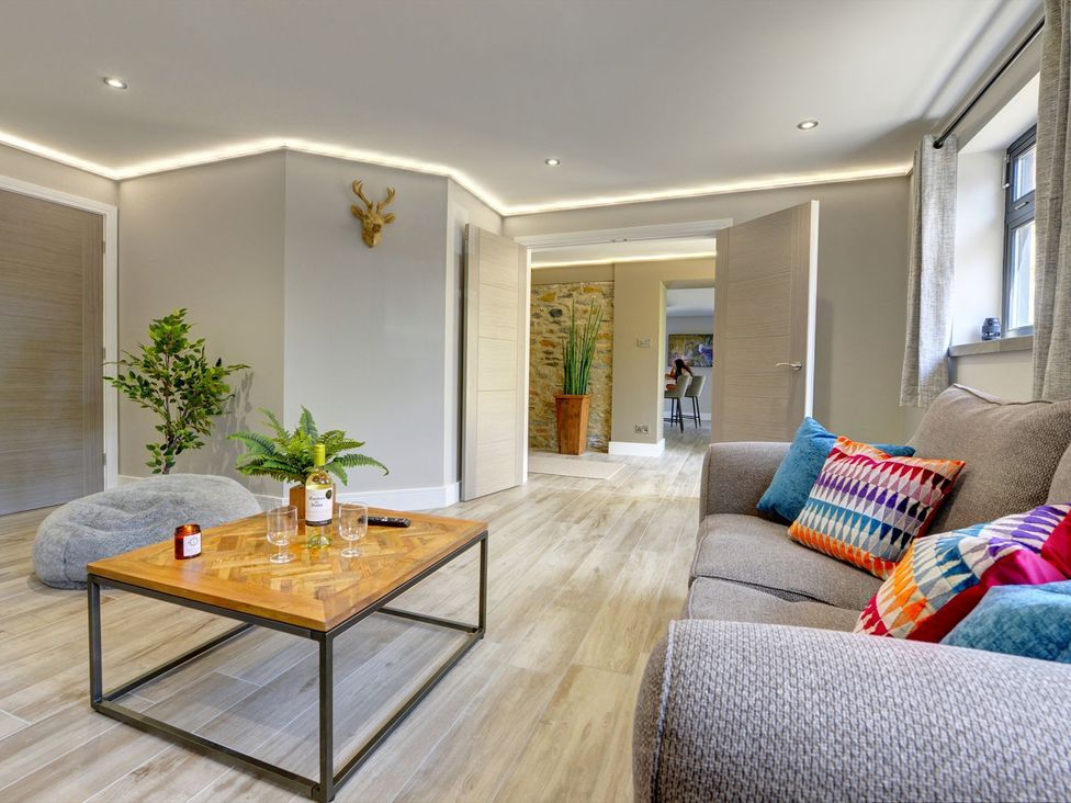 A living room with a sofa and coffee table at The Gate House near Aldbrough St. John near Barton