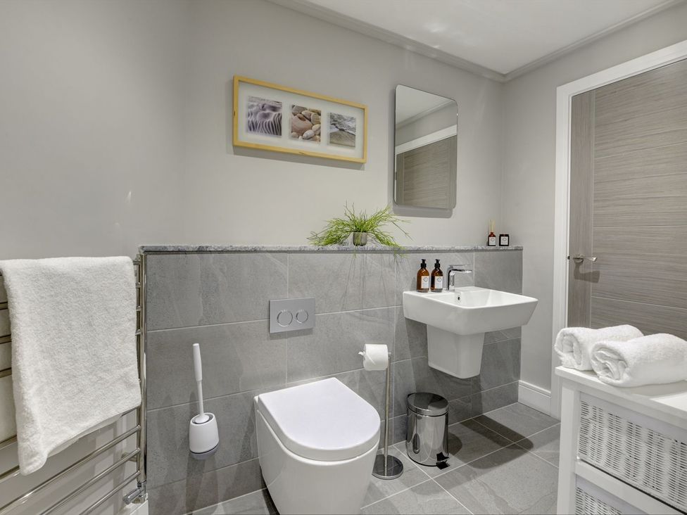 A bathroom with a sink and toilet at The Gate House in Aldbrough St. John near Barton