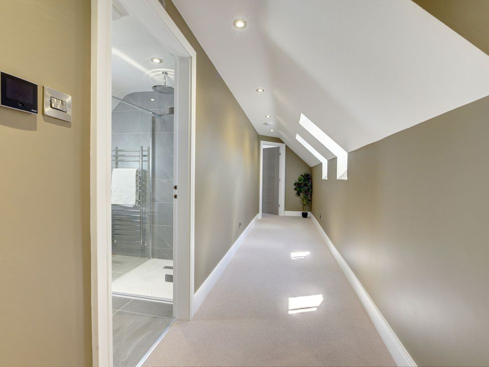 A hallway with a shower room at The Gate House in Aldbrough St. John near Barton