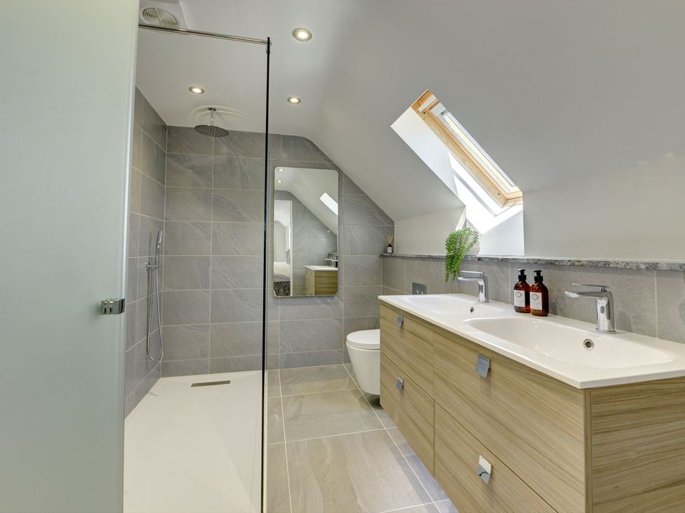 A bathroom with double basin and shower at The Gate House in Aldbrough St. John near Barton