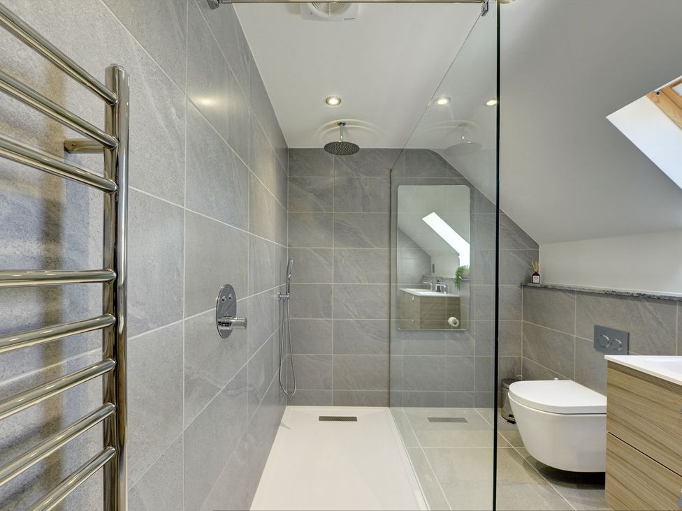 A bathroom with a shower, toilet, and sink at The Gate House in Aldbrough St. John near Barton