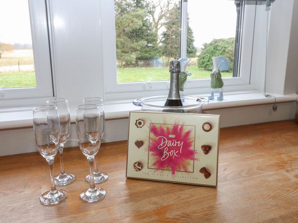 A champagne and chocolate box on a table at Hollymoor Hall Farm Richmond