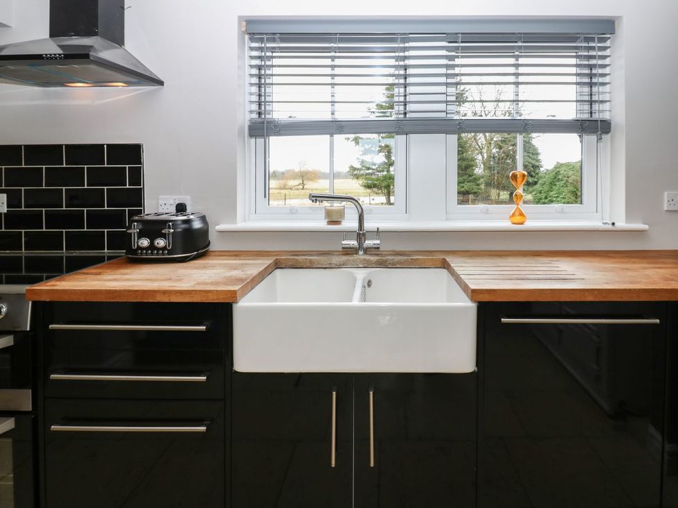 A kitchen with a sink and countertop at Hollymoor Hall Farm in Richmond