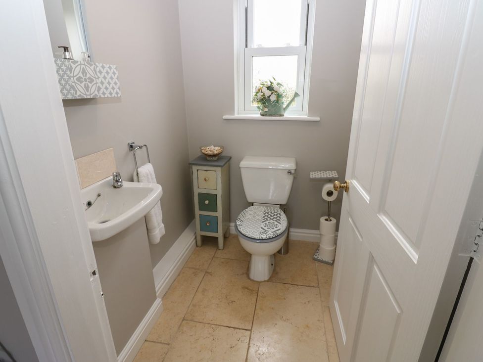 A bathroom with a sink and toilet at Hollymoor Hall Farm in Richmond
