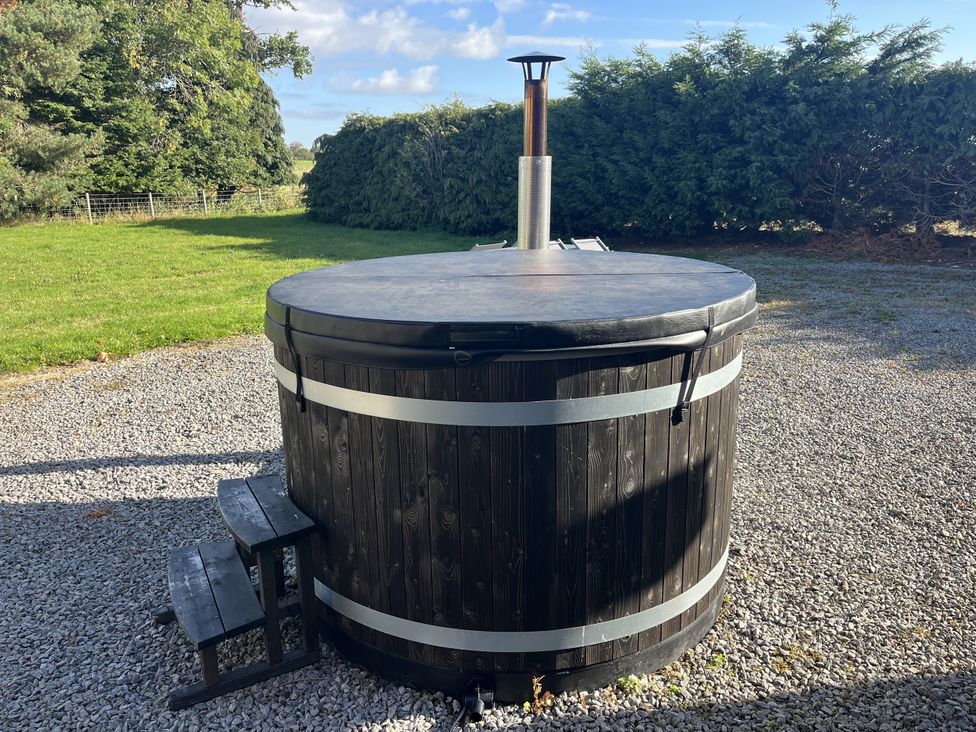 A hot tub with steps in an outdoor area at Hollymoor Hall Farm Richmond