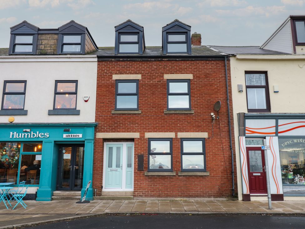 A brick building with a cafe and shop in front at 11 North Terrace Seaham
