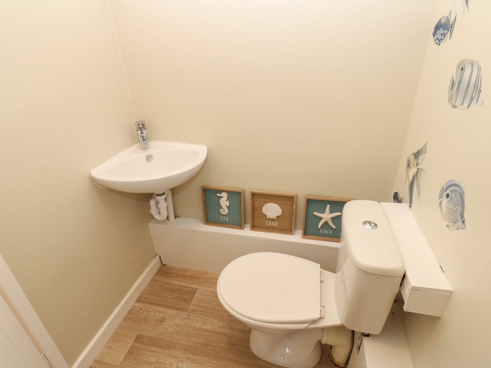 A bathroom with a toilet and sink at 11 North Terrace Seaham