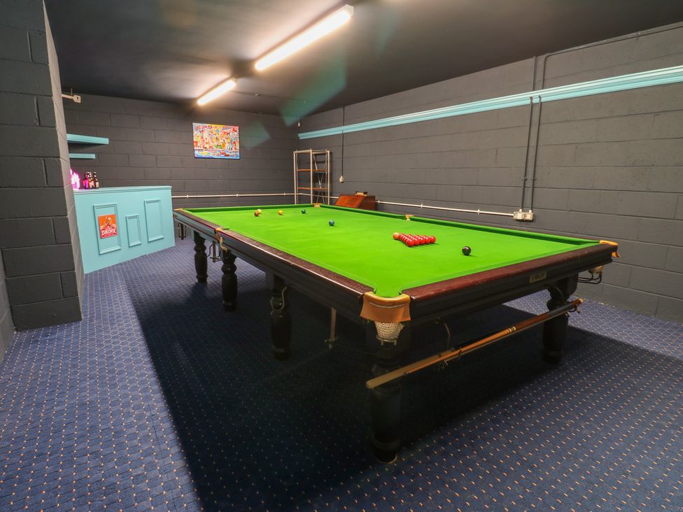 A games room with a snooker table and blue storage unit at 11 North Terrace in Seaham