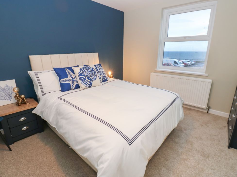 A bedroom with a bed and bedside table at 11 North Terrace in Seaham