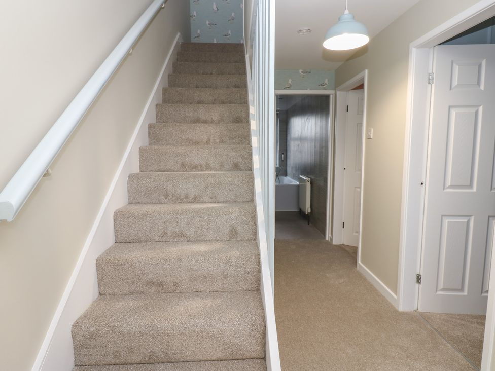 A staircase leading to the upper level in 11 North Terrace Seaham