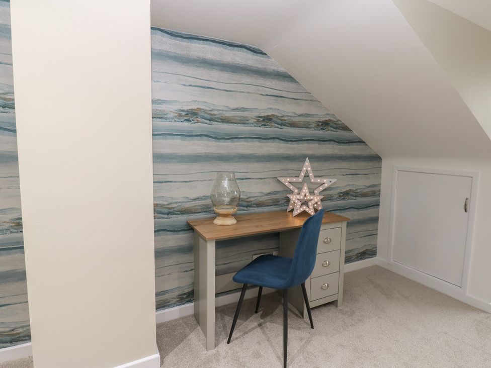 A study area with a desk and a chair at 11 North Terrace in Seaham