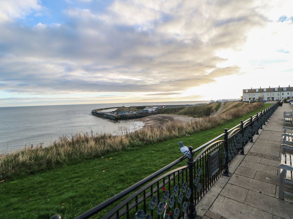 A view of the sea and grass with railings at 11 North Terrace in Seaham