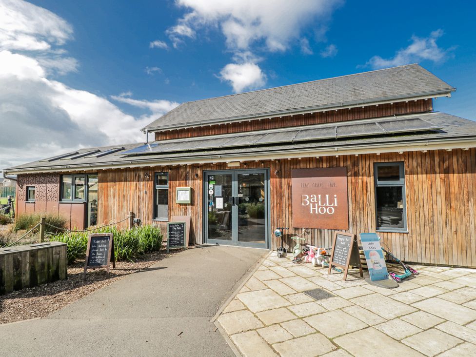An exterior view of BaLi Hoo restaurant with signage and pathway