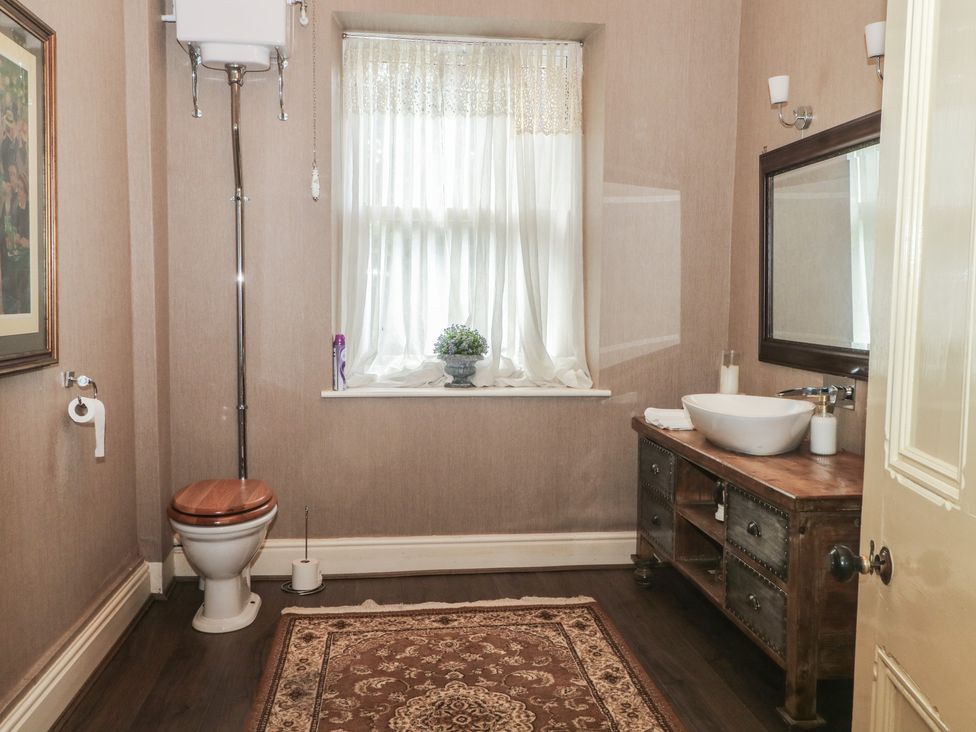 A bathroom with a sink and toilet at Stone House in Rossendale