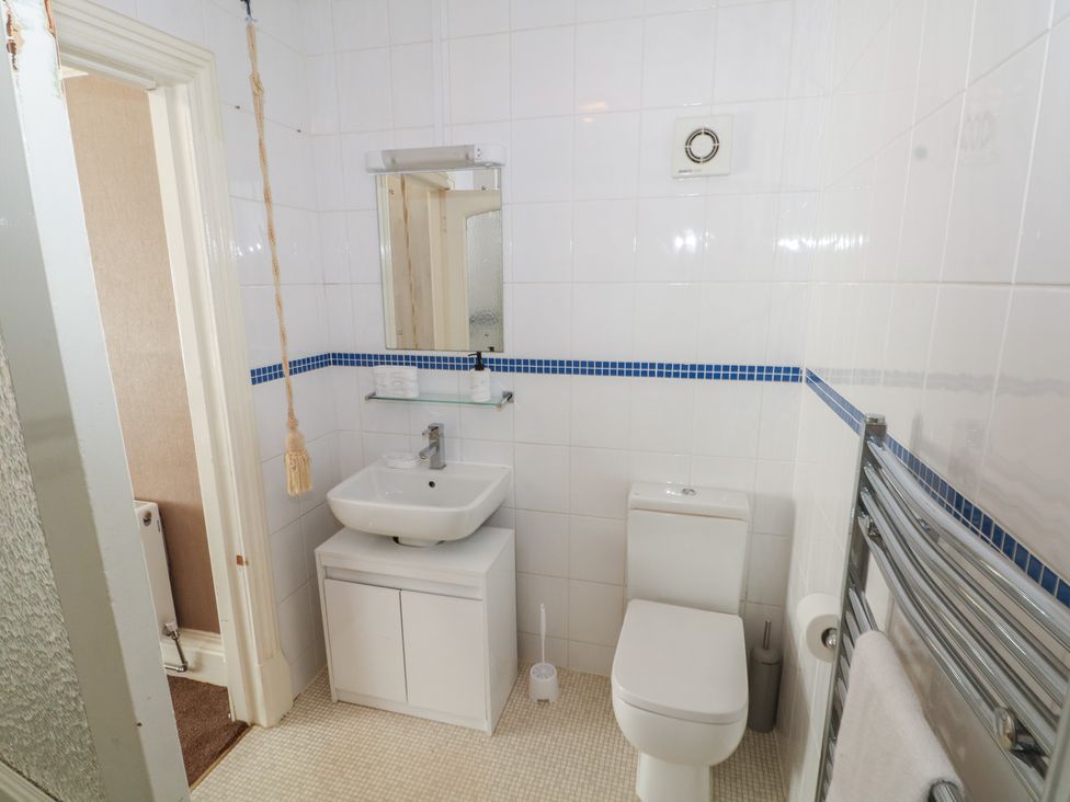 A bathroom with a sink and toilet at Stone House in Rossendale