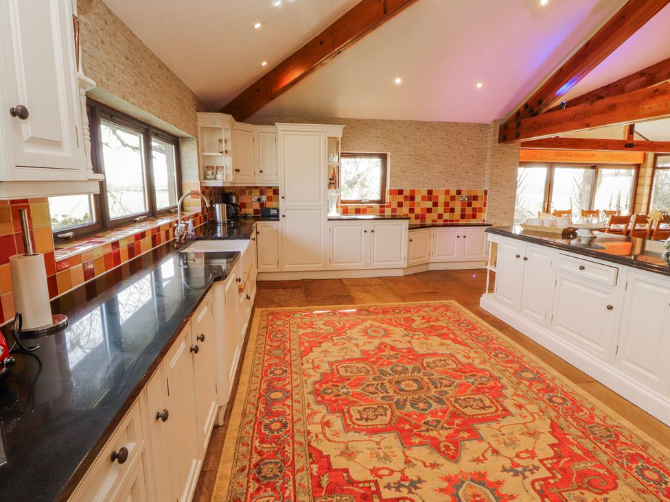 A kitchen with cabinets and a countertop at Old Riggs Paddock in Penrith