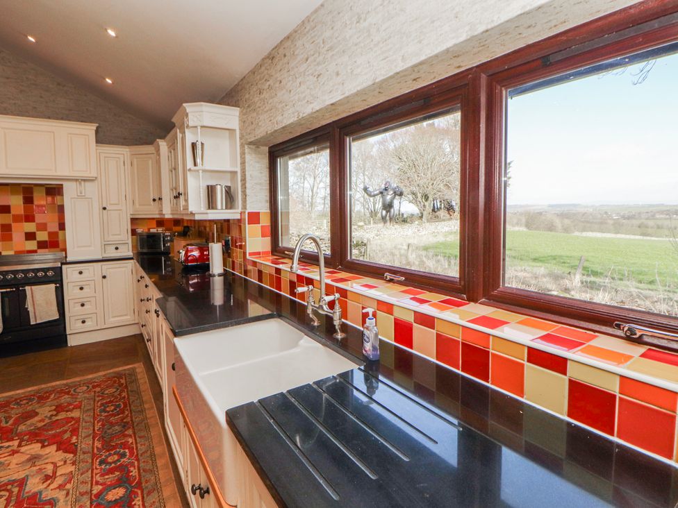 A kitchen with sink and stove at Old Riggs Paddock in Penrith
