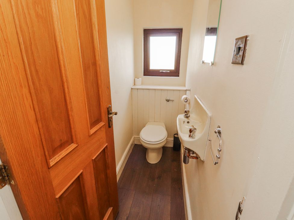 A bathroom with a toilet and sink at Old Riggs Paddock in Penrith