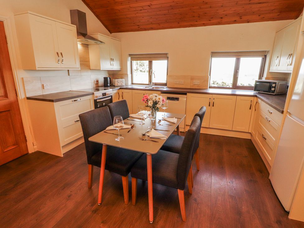 A kitchen with a dining table and chairs at Old Riggs Paddock in Penrith