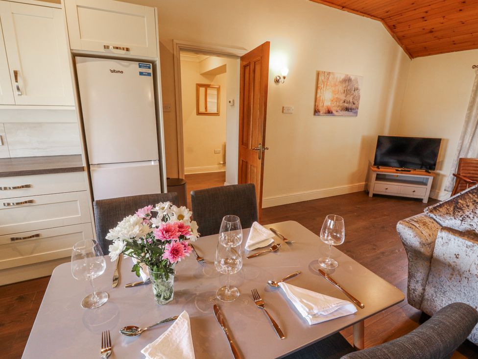 A dining room with a table set for a meal at Old Riggs Paddock in Penrith