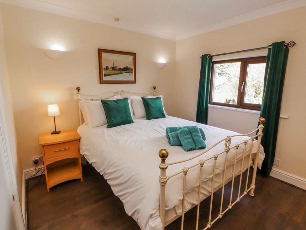 A bedroom with a bed and window at Old Riggs Paddock in Penrith