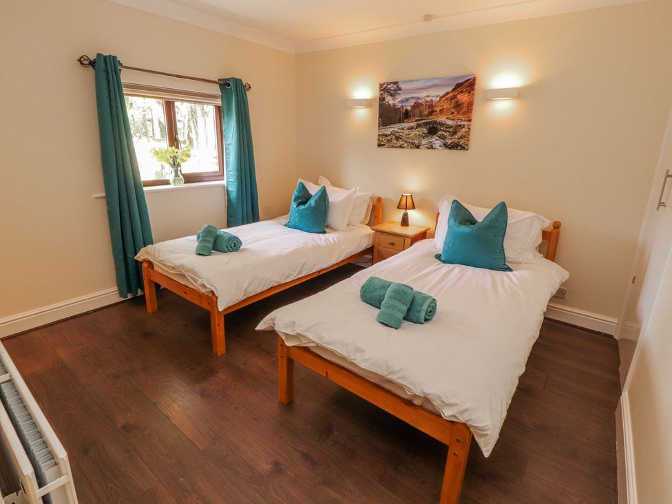 A bedroom with two beds and a window at Old Riggs Paddock in Penrith