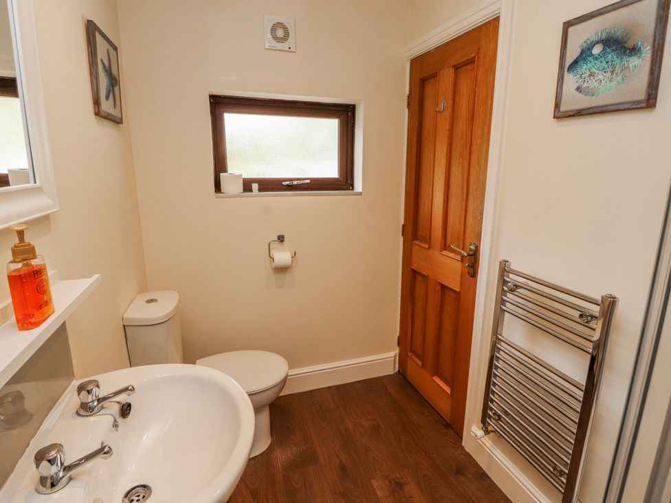A bathroom with a sink and toilet at Old Riggs Paddock in Penrith