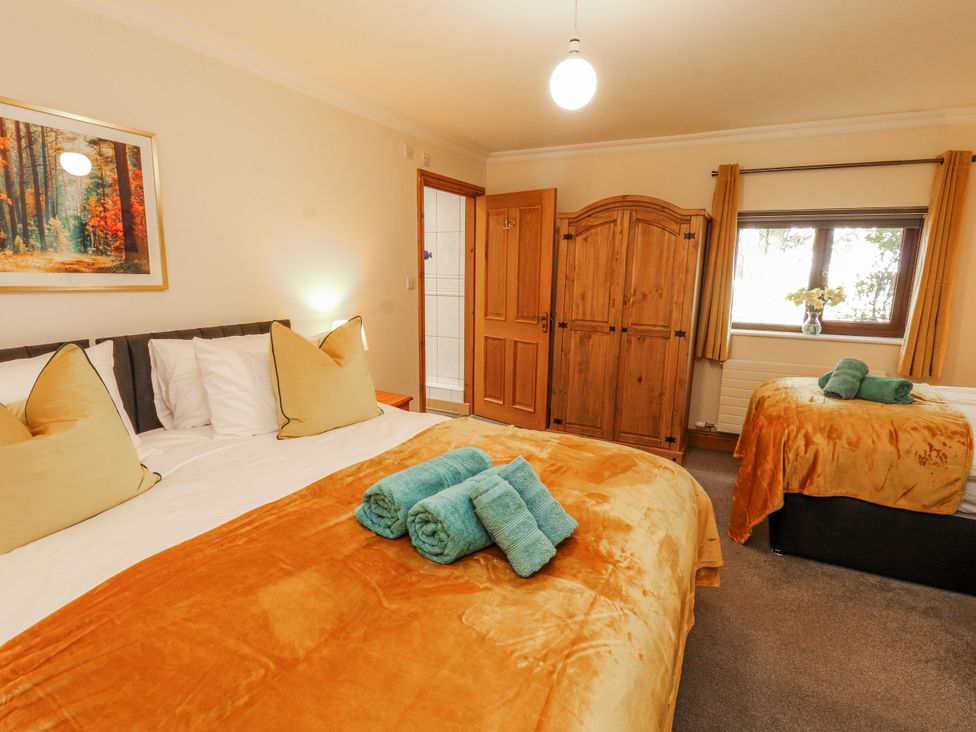 A bedroom with beds and a wardrobe at Old Riggs Paddock in Penrith