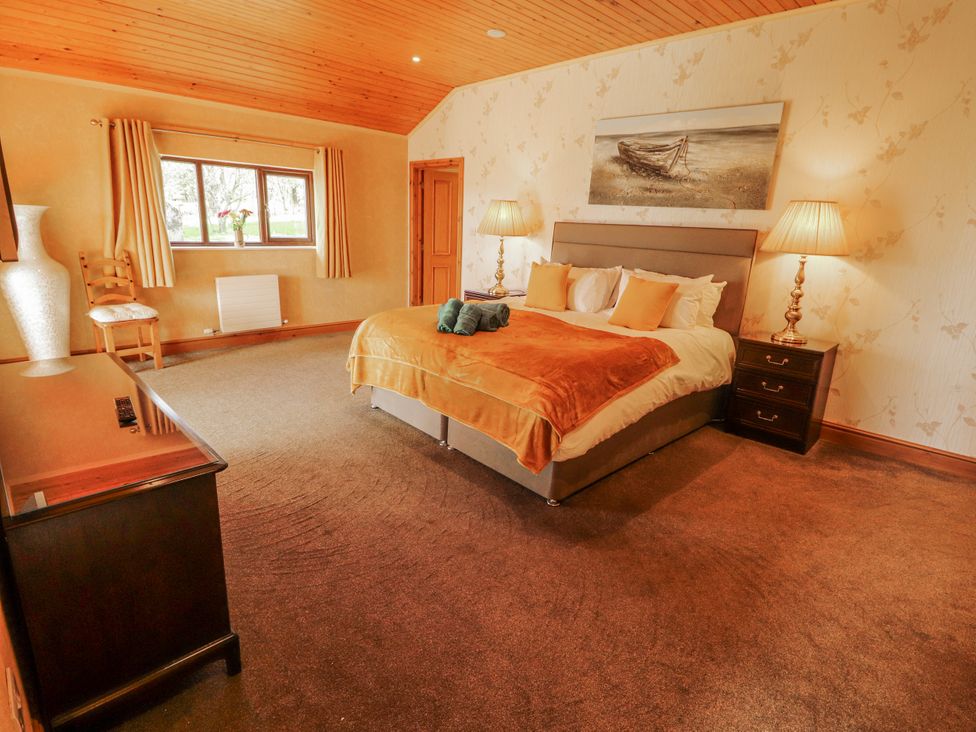 A bedroom with a bed and furniture at Old Riggs Paddock in Penrith