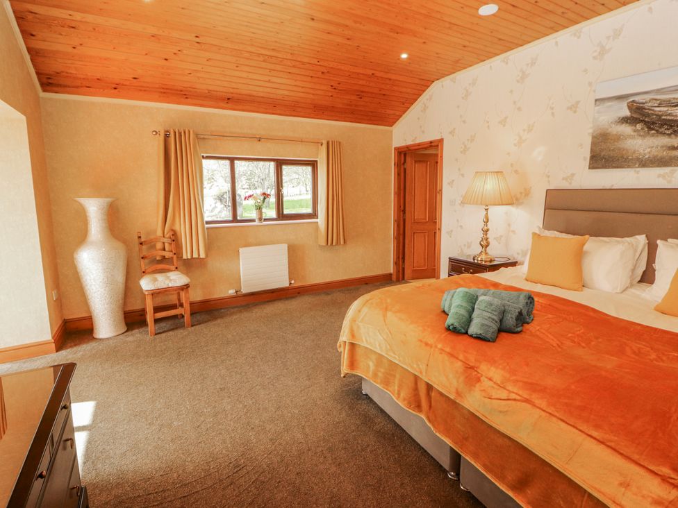 A bedroom with a bed and furniture at Old Riggs Paddock in Penrith